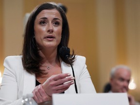 Cassidy Hutchinson, who was an aide to former White House Chief of Staff Mark Meadows during the administration of former U.S. President Donald Trump, demonstrates Trump's actions inside the presidential limousine on Jan. 6 as she testifies during a public hearing of the U.S. House Select Committee to investigate the Jan. 6 Attack on the U.S. Capitol, on Capitol Hill in Washington, June 28, 2022.