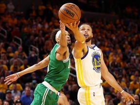 Stephen Curry of the Golden State Warriors shoots the ball against Derrick White of the Boston Celtics during Game 1 of the 2022 NBA Finals at Chase Center on June 2, 2022 in San Francisco.
