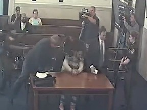 Tonio Hughes attacks Desean Brown in an Ohio courtroom.