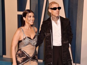 Kourtney Kardashian and Travis Barker at the Vanity Fair party in March 2022.
