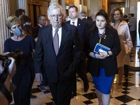 U.S. Senate Majority Leader Mitch McConnell (R-KY) walks with Ukrainian Ambassador to the United States Oksana Markarova, as they make their way to a Republican policy luncheon, at the U.S. Capitol on May 10, 2022 in Washington, D.C.