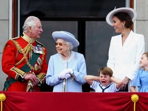 Queen Elizabeth, Prince Charles and Catherine, Duchess of Cambridge, along with Princess Charlotte and Prince Louis appear on the balcony of Buckingham Palace as part of Trooping the Colour parade during the Queen's Platinum Jubilee celebrations in London, Britain, June 2, 2022.