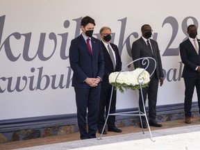 Prime Minister Justin Trudeau pauses after laying a wreath at the Kigali Genocide Memorial in Kigali, Rwanda on Thursday, June 23, 2022. More than 250,000 victims of the Genocide against the Tutsi have been buried in a mass grave at the memorial.