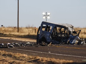 The damage bus sits on the side of the road at the scene of a fatal car wreck early Wednesday, March 16, 2022 half of a mile north of State Highway 115 on Farm-to-Market Road 1788 in Andrews County, Texas. A pickup truck crossed the center line of a two-lane road in Andrews County, about 50 km east of the New Mexico state line on Tuesday evening and crashed into a van carrying members of the University of the Southwest men's and women's golf teams, said Sgt. Steven Blanco of the Texas Department of Public Safety.