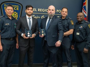 Peel Regional Police Const. Jason Beccario (second from right), shown receiving the Ontario Medal of Bravery in April, has been charged with assault.