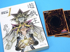 This photo shows Yu-Gi-Oh! manga comic and trading cards in Tokyo Thursday, July 7, 2022.