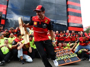 Race winner Charles Leclerc of Monaco and Ferrari celebrates with his team after the F1 Grand Prix of Austria at Red Bull Ring on July 10, 2022 in Spielberg, Austria.