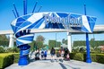 Visitors enter Disneyland on the day of the park's re-opening on April 30, 2021, in Anaheim, California. (Photo by VALERIE MACON/AFP via Getty Images)