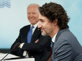 U.S. President Joe Biden and Canada's Prime Minister Justin Trudeau attend a session during the G7 summit in Carbis Bay, Cornwall, Britain, June 11, 2021.