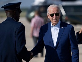 U.S. President Joe Biden disembarks Air Force One at Joint Base Andrews in Maryland on Wednesday, July 20, 2022.