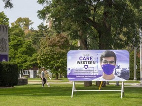 A sign outside Western University campus reminds students to be socially responsible amid COVID-19. Photo taken Sept. 22, 2020. (Derek Ruttan/The London Free Press)