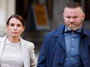Derby County manager Wayne Rooney and his wife Coleen Rooney leave the Royal Courts of Justice in London, Britain May 13, 2022.