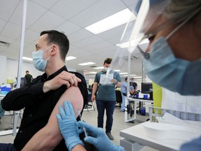 A man is vaccinated at a monkeypox vaccination clinic run by CIUSSS public health authorities in Montreal onJune 6, 2022.