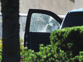 A vehicle's window is seen with a bullet hole at a fatal shooting in the parking lot of the Rio Can Langley Centre in Langley, B.C., Monday, July 25, 2022.