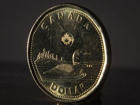 A Canadian dollar coin is pictured in North Vancouver, B.C. Wednesday, May 29, 2019.