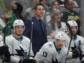 San Jose Sharks head coach Bob Boughner, center top, center Jasper Weatherby (26), Nick Bonino (13) and center Logan Couture (39) watch as they play the Dallas Stars during the first period of an NHL hockey game in Dallas, Saturday, April 16, 2022. The San Jose Sharks have abruptly fired coach Bob Boughner and his staff two months after the regular season ended. The team confirmed the moves Friday, July 1, 2022.