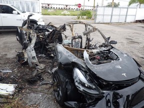 This image provided by the National Transportation Safety Board shows damage to a 2021 Tesla Model 3 Long Range Dual Motor electric car following a crash in September, 2021, in Coral Gables, Fla.