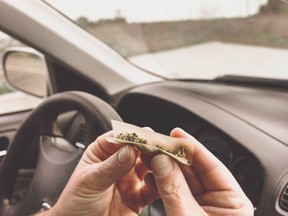 This illustration shows a man rolling a joint in a car