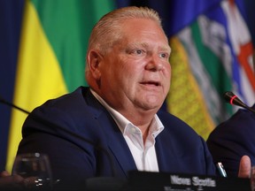 Premier Doug Ford responds to a question from the media on the final day of the summer meeting of the Canada's Premiers in Victoria, B.C., on Tuesday, July 12, 2022.