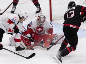 Team Switzerland's goaltender Kevin Pasche (30) makes a save on Team Canada's Kent Johnson (13) during third period IIHF World Junior Championship action at Rogers Place in Edmonton, on Wednesday, Aug. 17, 2022. Canada won 6-3.
