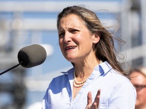 Deputy Prime Minister Chrystia Freeland (at podium) speaks after touring a hydrogen production facility operated by Air Products, an industrial gases company, before a media conference in Sherwood Park, on Thursday, Aug. 25, 2022.