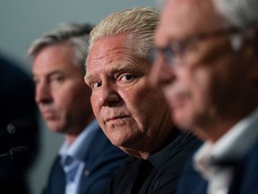 Ontario Premier Doug Ford, centre, attends a press conference with Nova Scotia Premier Tim Houston, left, and New Brunswick Premier Blaine Higgs in Moncton, N.B., on Aug. 22, 2022.