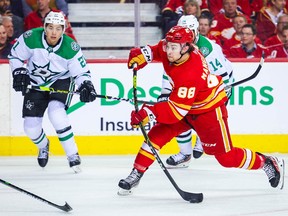 Calgary Flames left wing Andrew Mangiapane (88) shoots the puck against the Dallas Stars during the second period in Game 5 of the first round of the 2022 Stanley Cup Playoffs at Scotiabank Saddledome on May 11, 2022.
