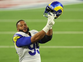 Aaron Donald of the Los Angeles Rams reacts following a fourth down stop during the fourth quarter of Super Bowl LVI against the Cincinnati Bengals at SoFi Stadium on Feb. 13, 2022 in Inglewood, Calif.