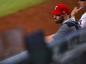 Texas Rangers manager Chris Woodward (8) watches the game between the Texas Rangers and the Baltimore Orioles during the ninth inning at Globe Life Field.