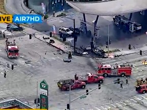 This aerial image taken from video provided by KABC-TV shows authorities responding to a traffic accident in the suburban neighborhood Windsor Hills, of Los Angeles, on Thursday, Aug. 4, 2022.