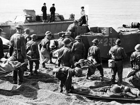 Members of the Royal Canadian Medical Corps evacuate Allied soldiers from the beach after the Dieppe, France, raid during the Second World War.