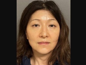 Mugshot of Emily Yu, accused by her husband of poisoning him and abusing him and their two children.
