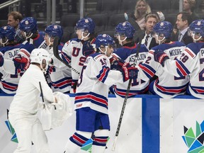 Matt Coronato of the United States celebrates a goal against Austria during the IIHF World Junior Hockey Championship at Rogers Place in Edmonton on Saturday, Aug. 13, 2022. The U.S. won 7-0.