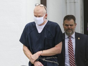 Alex Murdaugh is escorted out of the Colleton County Courthouse in Walterboro, S.C., on Wednesday, July 20, 2022.