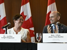 Minister of Health Jean-Yves Duclos applauds after announcing Dr. Leigh Chapman as Canada's Chief Nursing Officer during a news conference in Ottawa, Tuesday, Aug. 23, 2022.