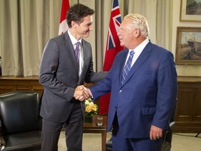 Prime Minister Justin Trudeau (left) meets Ontario Premier Doug Ford, at the Queen's Park Legislature in Toronto, Tuesday, Aug. 30, 2022.