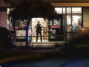 Emergency personnel respond to a shooting at the Forum shopping centre in Bend, Ore., Sunday, Aug. 28, 2022.
