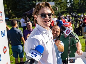 Montreal Canadiens winger Cole Caufield laughs with reporters prior to the team's annual golf tournament in Laval on Sept. 12, 2022.