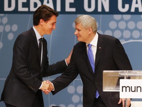 Conservative Leader Stephen Harper, right, and Liberal Leader Justin Trudeau shakes hands after participating in the Munk Debate on Canada's foreign policy in Toronto, on Monday, Sept. 28, 2015.