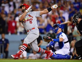 Cardinals designated hitter Albert Pujols hits a three-run home run, the 700th of his major league career, against the Dodgers during the fourth inning at Dodger Stadium in Los Angeles, Friday, Sept. 23, 2022.