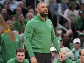 Boston Celtics head coach Ime Udoka reacts during the fourth quarter of Game 3 of basketball's NBA Finals against the Golden State Warriors, Wednesday, June 8, 2022, in Boston.