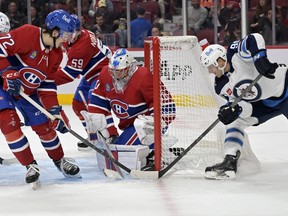 Winnipeg Jets forward Cole Maier scores a goal against Montreal Canadiens goalie Cayden Primeauat the Bell Centre Thursday night.   USA TODAY SPORTS