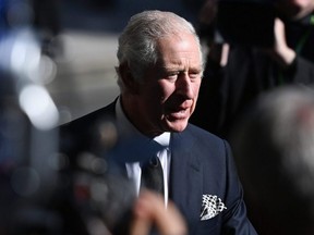 King Charles III speaks to the public as he departs St. Anne's Cathedral after attending a service of reflection in memory of Queen Elizabeth II in Belfast, Northern Ireland, Tuesday, Sept. 13, 2022.
