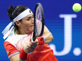 Ons Jabeur of Tunisia returns a shot against Caroline Garcia of France during their semifinal match at the U.S. Open at USTA Billie Jean King National Tennis Center in New York City, Thursday, on Sept. 8, 2022.