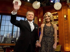 In this Nov. 18, 2011 file photo, Regis Philbin and Kelly Ripa appear on Regis' farewell episode of "Live! with Regis and Kelly" in New York.
