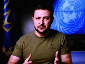 Ukrainian President Volodymyr Zelenskyy is seen on a screen as he remotely addresses the 77th session of the United Nations General Assembly at the UN headquarters in New York City, Wednesday, Sept. 21, 2022.