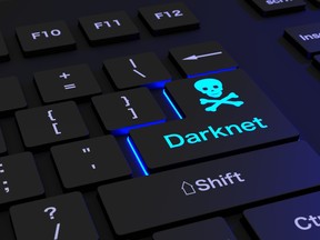 This photo illustration shows a black keyboard with the words darknet.