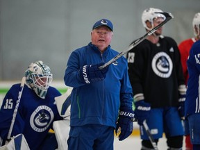 Vancouver Canucks head coach Bruce Boudreau gives instructions to players during the team's training camp in Whistler.