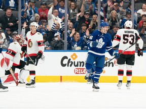 Alex Steeves of the Leafs celebrates after scoring a goal against the Senators during the second period of Saturday afternoon's NHL pre-season matchup.