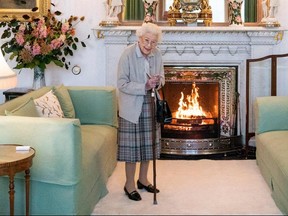 In this file photo taken on Sept. 6, 2022, Queen Elizabeth II waits to meet with new Conservative Party leader and Britain's Prime Minister-elect at Balmoral Castle in Ballater, Scotland.